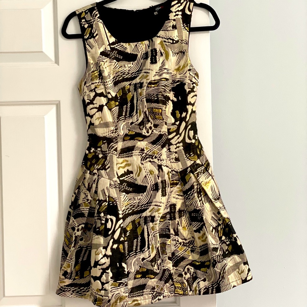 Worn once! Black and gold mini dress.